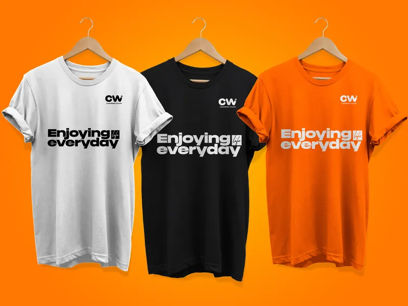 CoastWIDE Church T-shirts in white, black and orange, each printed with the CW mark and “Enjoying everyday”